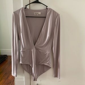 House of CB long sleeved bodysuit. Worn once.